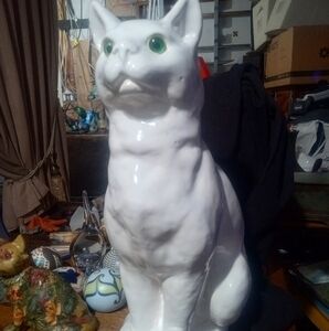 White ceramic cat with green eyes. No markings or signature. 16" tall.